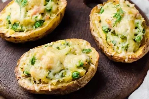 Cheese stuffed potatoes with peas 